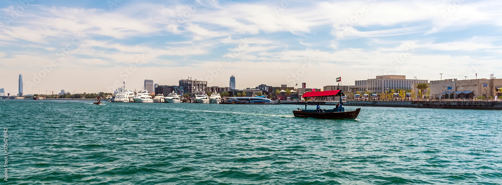 Abra, water taxis ply their trade on the Dubai Creek in the UAE in springtime