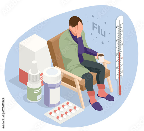A sick upset man with a cup of tea, sitting in a chair covered with a blanket, freezes and has a fever. Sick girl with flu symptoms. Medicine Disease Illness.