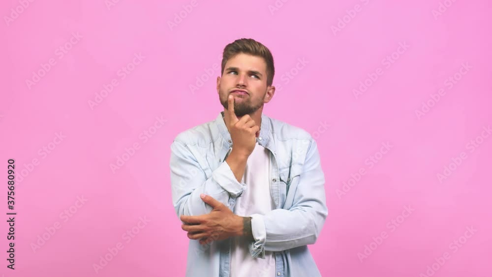 Young caucasian handsome man doubting and confused, thinking of an idea or worried about something Young caucasian handsome man doubting and confused, thinking of an idea or worried about something