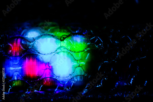 abstract background created with a colorful image through a sheet of plastic bubble wrap © Roberto Sorin