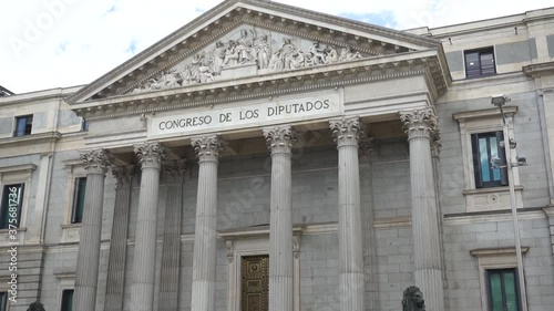 Tilt reveal shot of Palacio de las Cortes, Congress of the Deputies building in Madrid photo