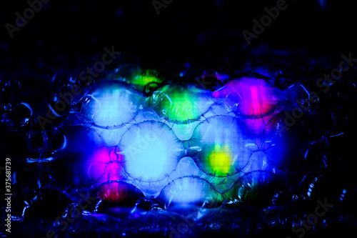 abstract background created with a colorful image through a sheet of plastic bubble wrap