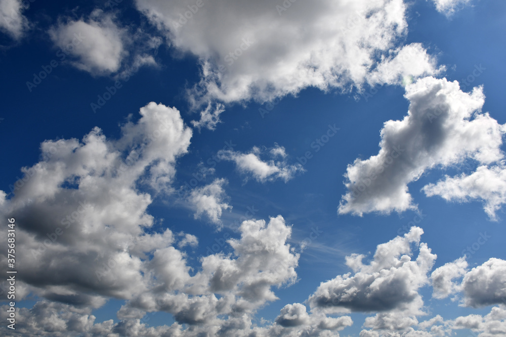Big white Cumulus clouds in a blue sky. Big white Cumulus clouds in a blue sky.