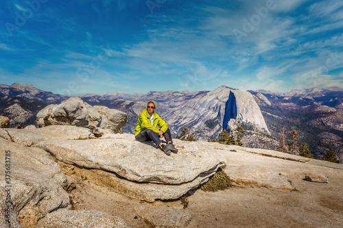 Backpacking in the Yosemite National Park, woman enjoying the view photo