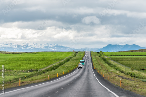 Mountains view in Hveragerdi, Iceland with road trip car and truck on ring road on cloudy day and south golden circle route, Toyota dealer © Kristina Blokhin