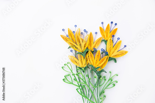 Beautiful flowers designs isolated on white background. Hand made of paper quilling technique.