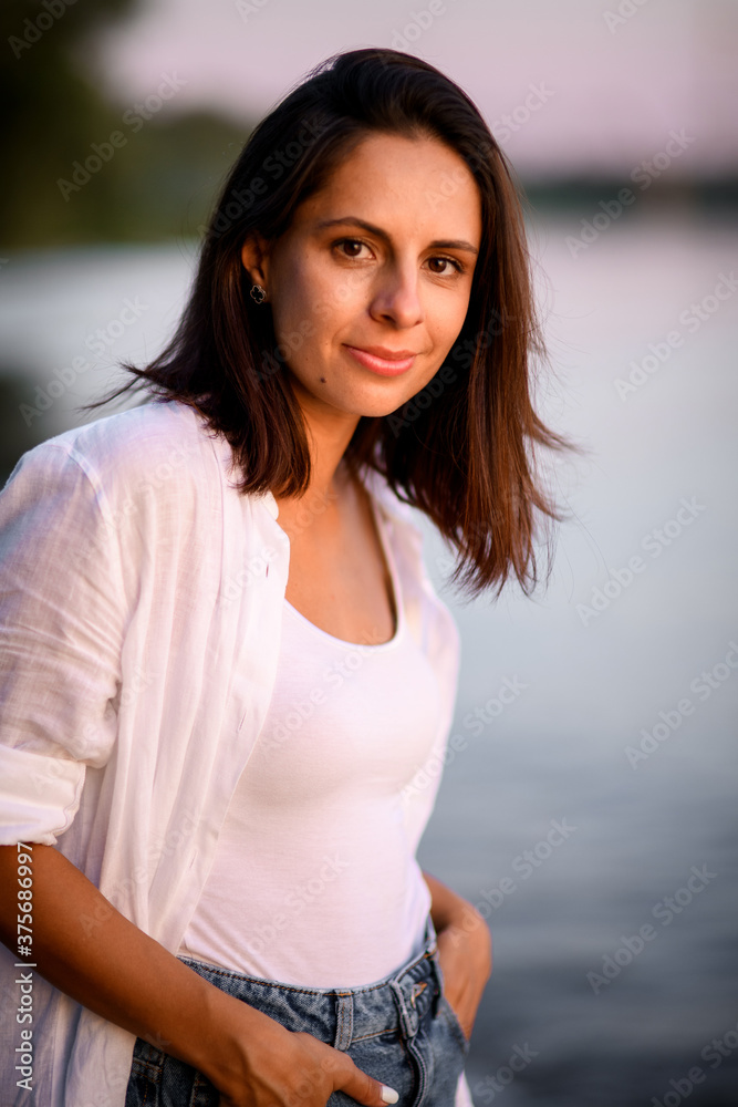 handsome young smiling dark haired woman in white clothes handsome young smiling dark haired woman in white clothes