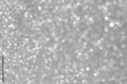 Silver abstract background with bokeh defocused lights