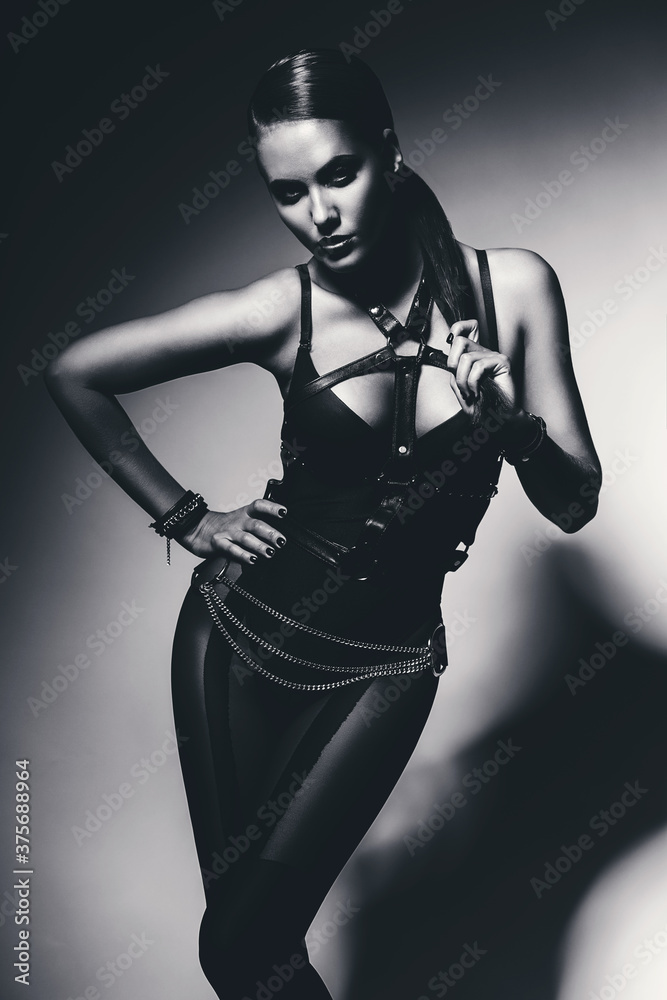 monochrome sexy woman in black leather bandage monochrome sexy woman in black leather bandage