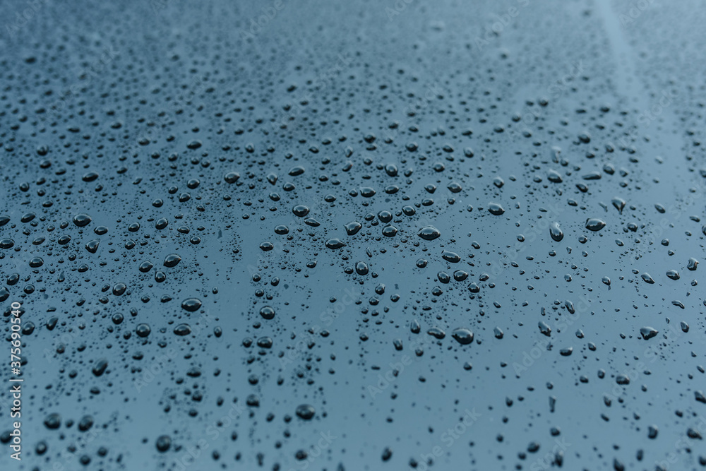 Texture of raindrops on the blue glass. Texture of raindrops on the blue glass.