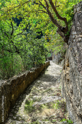 A stone road descends into the gorge of the Aniene river next to the Villa of Manlio Vopisco. Tivoli  Italy