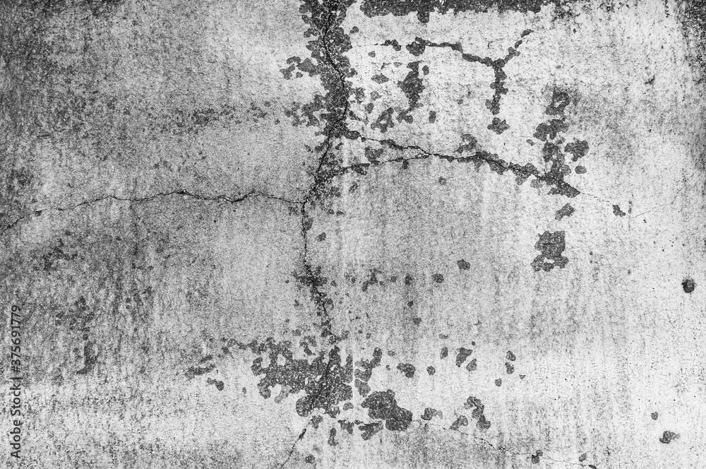 Fototapeta premium Texture of old gray painted building wall with cracks and smudges close up