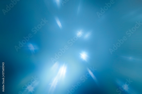 Abstract background of bright blue rays and white stars