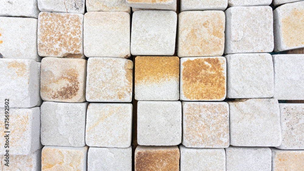 Stone tiles for paving paths. Stone paving background. Background with squares. Texture with square cells. Stone tiles for paving paths. Stone paving background. Background with squares. Texture with square cells.