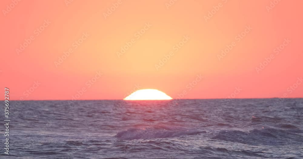 Beautiful red sunrise in the sea or ocean Beautiful red sunrise in the sea or ocean
