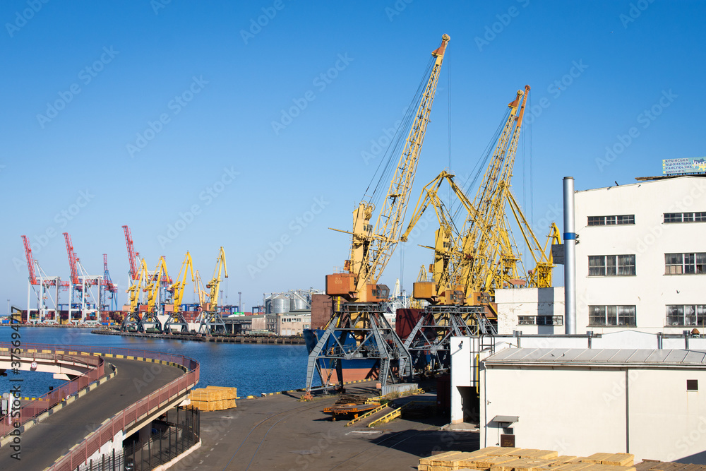 industrial photo of cargo port and cranes 