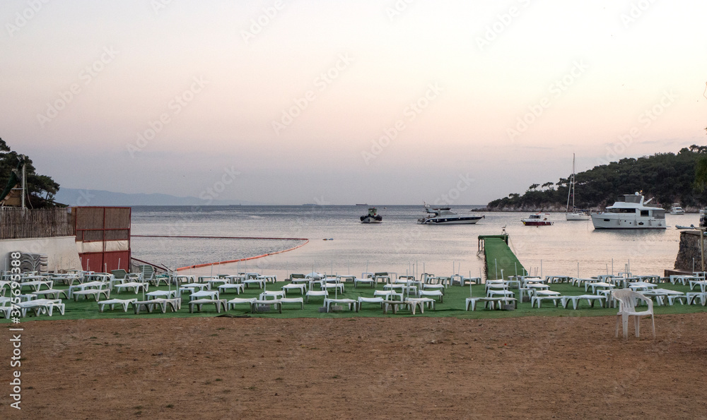 Obraz premium Sunset view in a beautiful bay in the last days of summer. The end of the Summer Season.