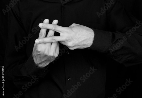 mannequin and black and white photography demonstrating sign language using hands