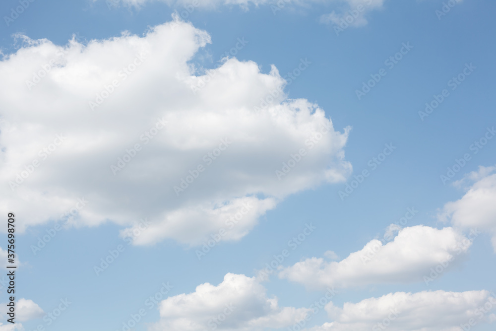 Pastel white clouds on baby blue sky, natural abstract background Pastel white clouds on baby blue sky, natural abstract background