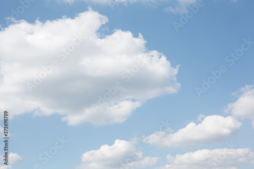 Pastel white clouds on baby blue sky, natural abstract background