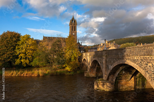 The river Tweed at Peebles, showing the Tweed Bridge and the Old Parish Church, Scottish Borders, UK