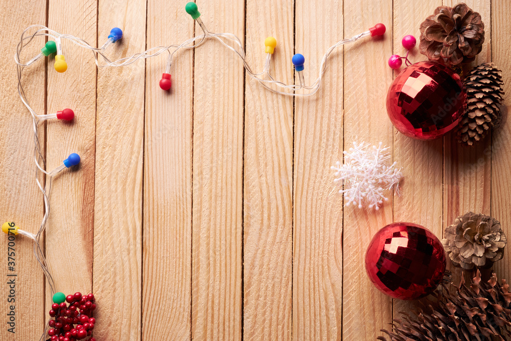 christmas decoration over wooden desk backdrop. festive ornament frame. copy space. above view