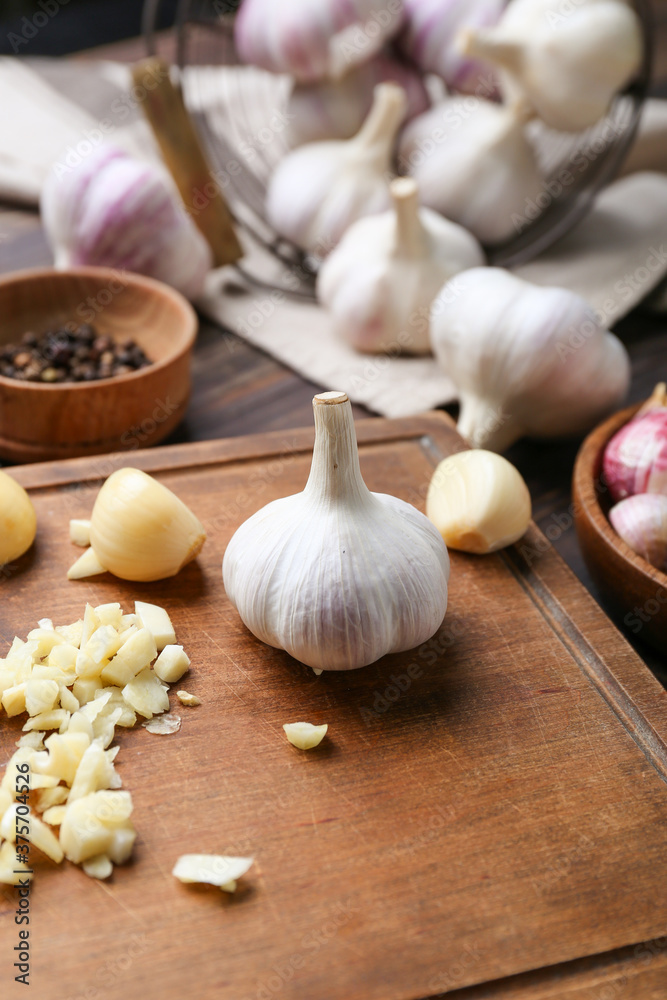 Composition with fresh garlic on wooden background Composition with fresh garlic on wooden background