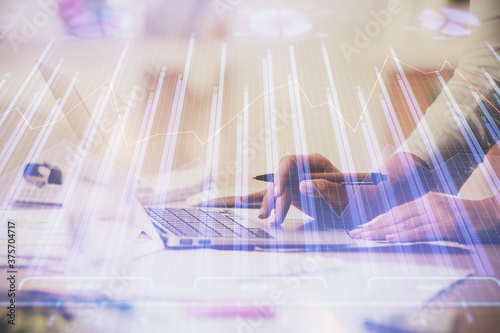 Multi exposure of woman hands typing on computer and financial chart hologram drawing. Stock market analysis concept.