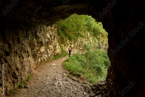 young woman hiking in mountain forest