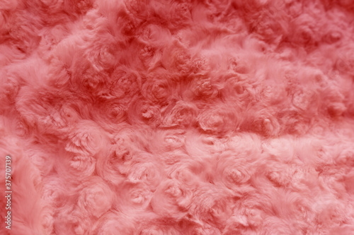 Pink background from faux fur with rose texture. © Elena Shi