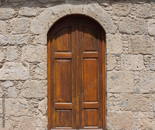 Old Medieval door in a stone wall