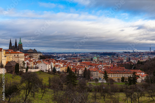 Panorama aerial view of Prague cityscape and skyline with Prague Castle and St. Vitus Cathedral in Mala Strana old town from Petrin Hill on the day with blue sky cloud, Czech Republic.