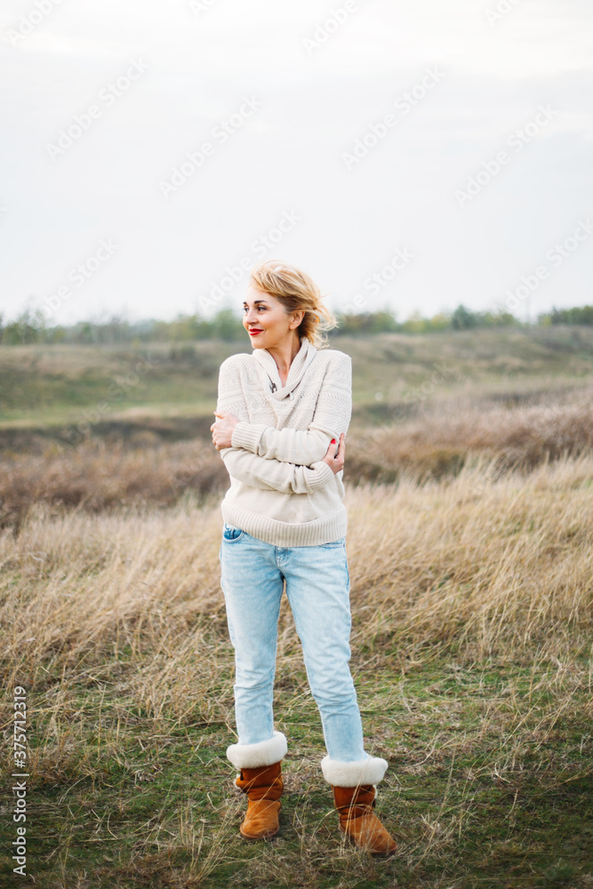 Beautiful middle aged woman standing outside Beautiful middle aged woman standing outside