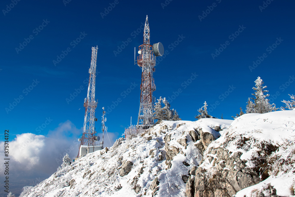 Antennas on the top of a mountain in winter