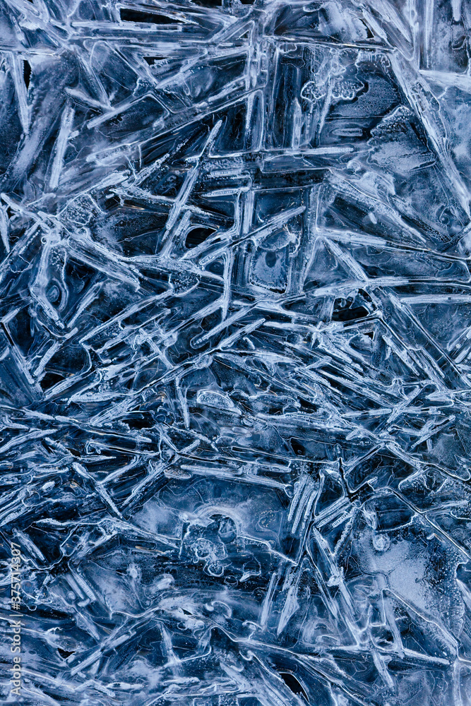 Background of frozen ice crystals formed due to dropping temperatures. Background of frozen ice crystals formed due to dropping temperatures.