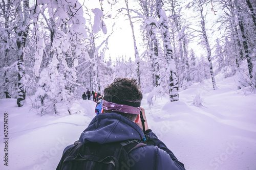 Photographer taking a shot of a group of hikers in front of him