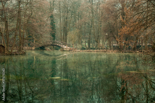 Wooden Bridge and a lake in Autumn
