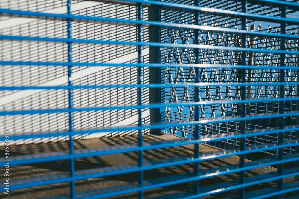 Metal security gate over warehouse doorway Metal security gate over warehouse doorway
