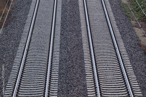 Parallel railroad tracks viewed from above. two ways.