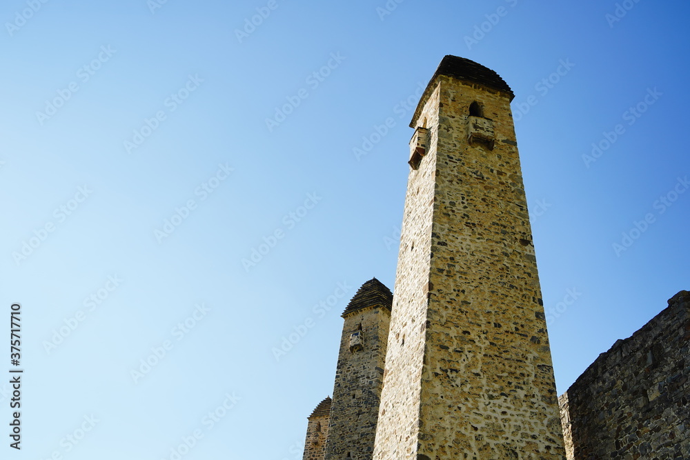 Old stone tower. Ancient stone building of old town