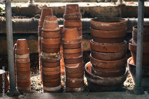 Stacked small terracotta pot collection photo