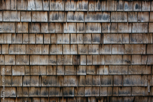 Old wooden shingle texture on a log cabin