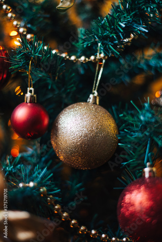 Red And Gold Ornaments On The Christmas Tree photo