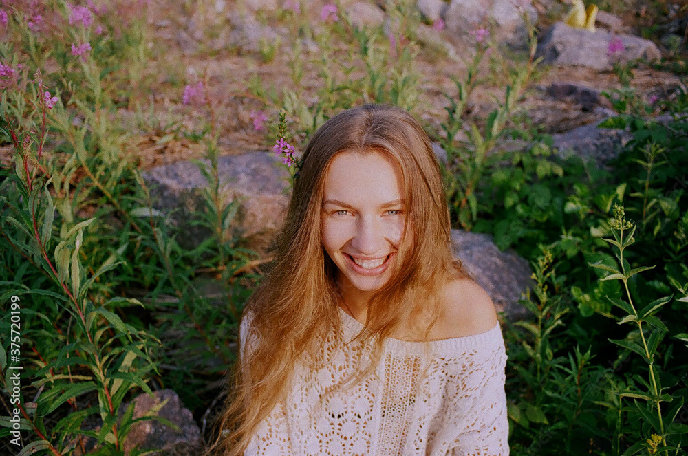 Smiling young woman looking at camera Smiling young woman looking at camera
