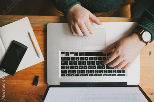 High-Angle View of a Man at His Laptop photo