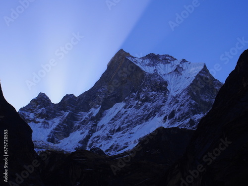 A climber, and two colored sky, it was caused by the light of sunrise, ABC (Annapurna Base Camp) Trek, Annapurna, Nepal