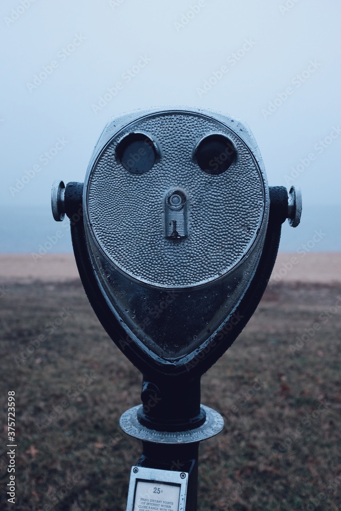 Binocular telescope camera on a foggy beach during the winter months in Maryland Binocular telescope camera on a foggy beach during the winter months in Maryland