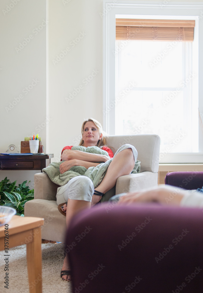 Therapy: Woman in Counseling Holds a Blanket For Comfort