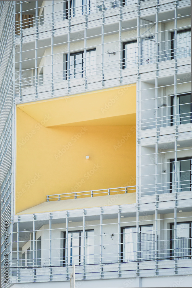 A white building with a yellow sector
