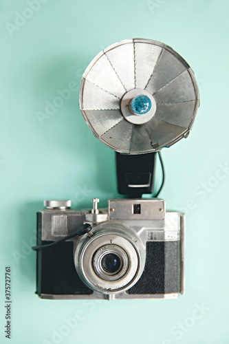 vintage / old film camera with flash attached